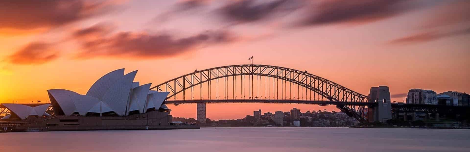 beautiful-shot-sydney-harbor-bridge-with-light-pink-blue-sky (1)