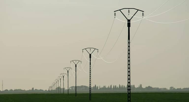 Power Lines on Metal Poles Installed in a Field